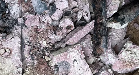 Red concrete broken after dig.