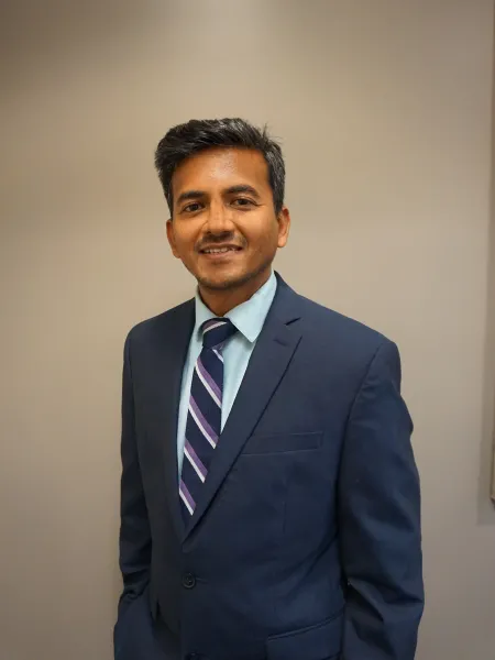 Tejas Pevekar poses for headshot.